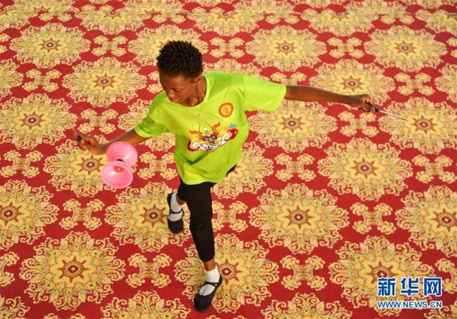 Overseas students practice acrobatics at the Wuqiao Acrobatic Art School in Cangzhou, Hebei Province, on Monday, May 20, 2019. [Photo: Xinhua]