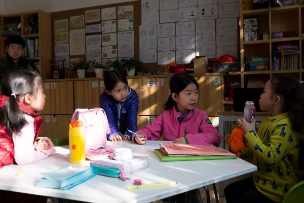 Students discuss with each other during a class br